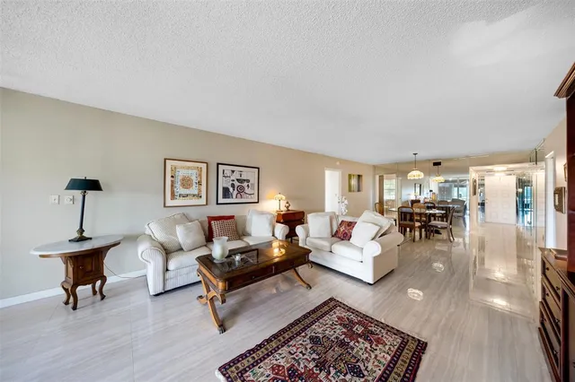 a bedroom with a bed a large window and flat screen tv