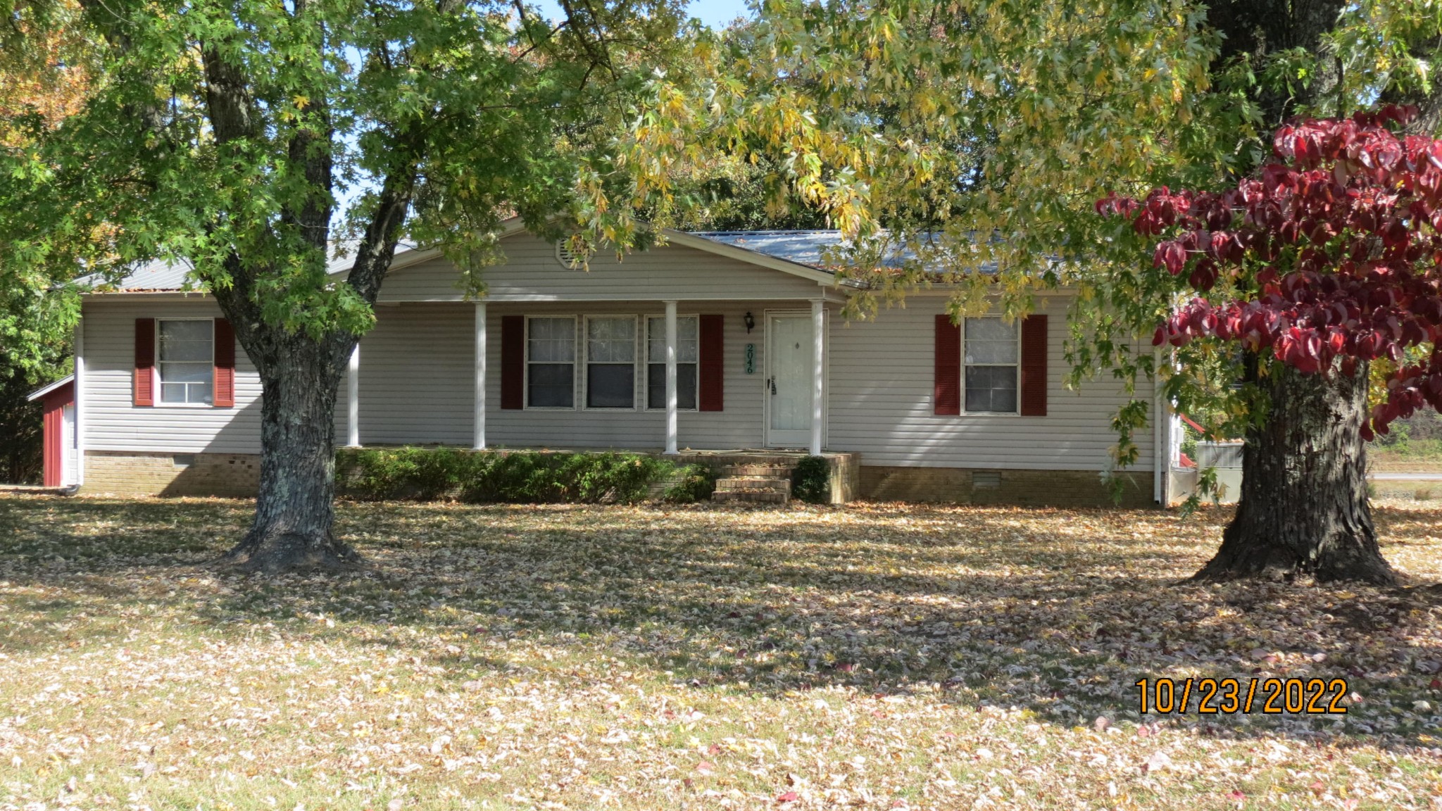 2046 Old Snow Hill Road Dowelltown, TN 37059 - Photo 5 of 34 a front view of a house with a yard garage and chair