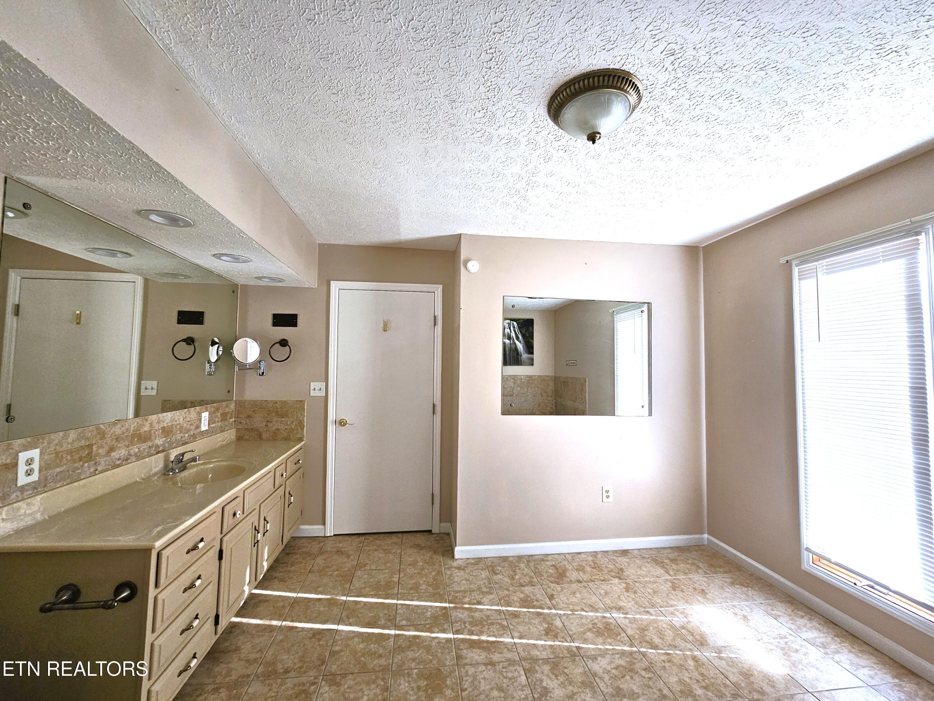 9430 North Ruggles Ferry Pike Strawberry Plains, TN 37871 - Photo 15 of 27 Ruggles Ferry ensuite primary bedroom vi