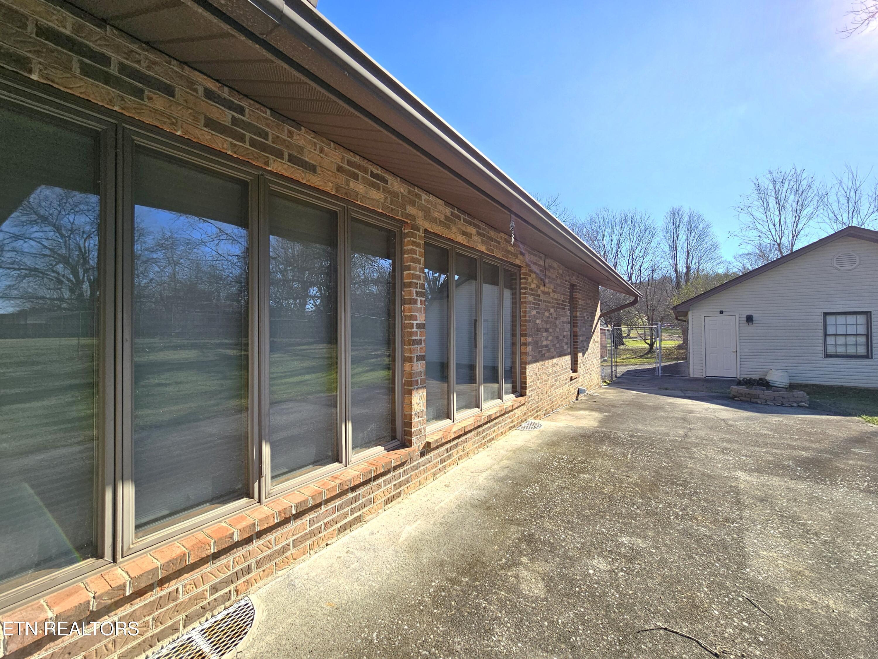 9430 North Ruggles Ferry Pike Strawberry Plains, TN 37871 - Photo 23 of 27 Outside of LR window wall