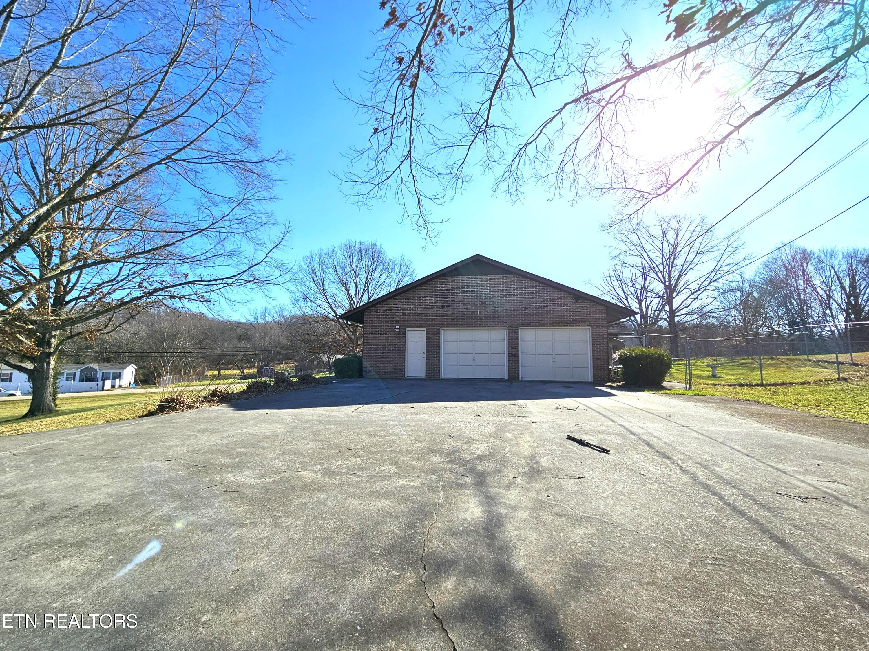 9430 North Ruggles Ferry Pike Strawberry Plains, TN 37871 - Photo 5 of 27 Attached garage with separate entry door