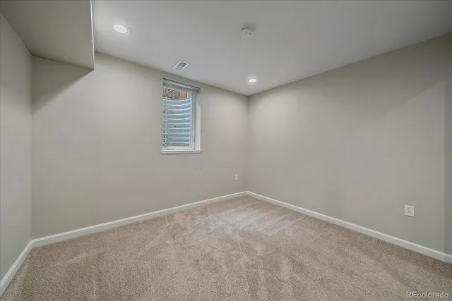a bathroom with a sink a toilet a mirror and vanity