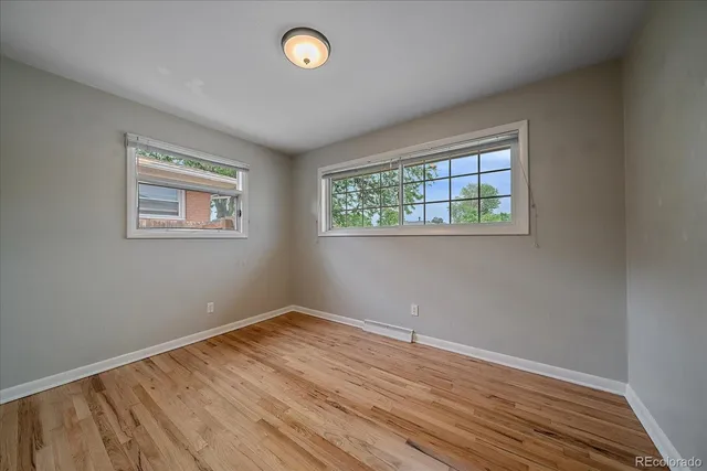 a view of room with wooden floor and window
