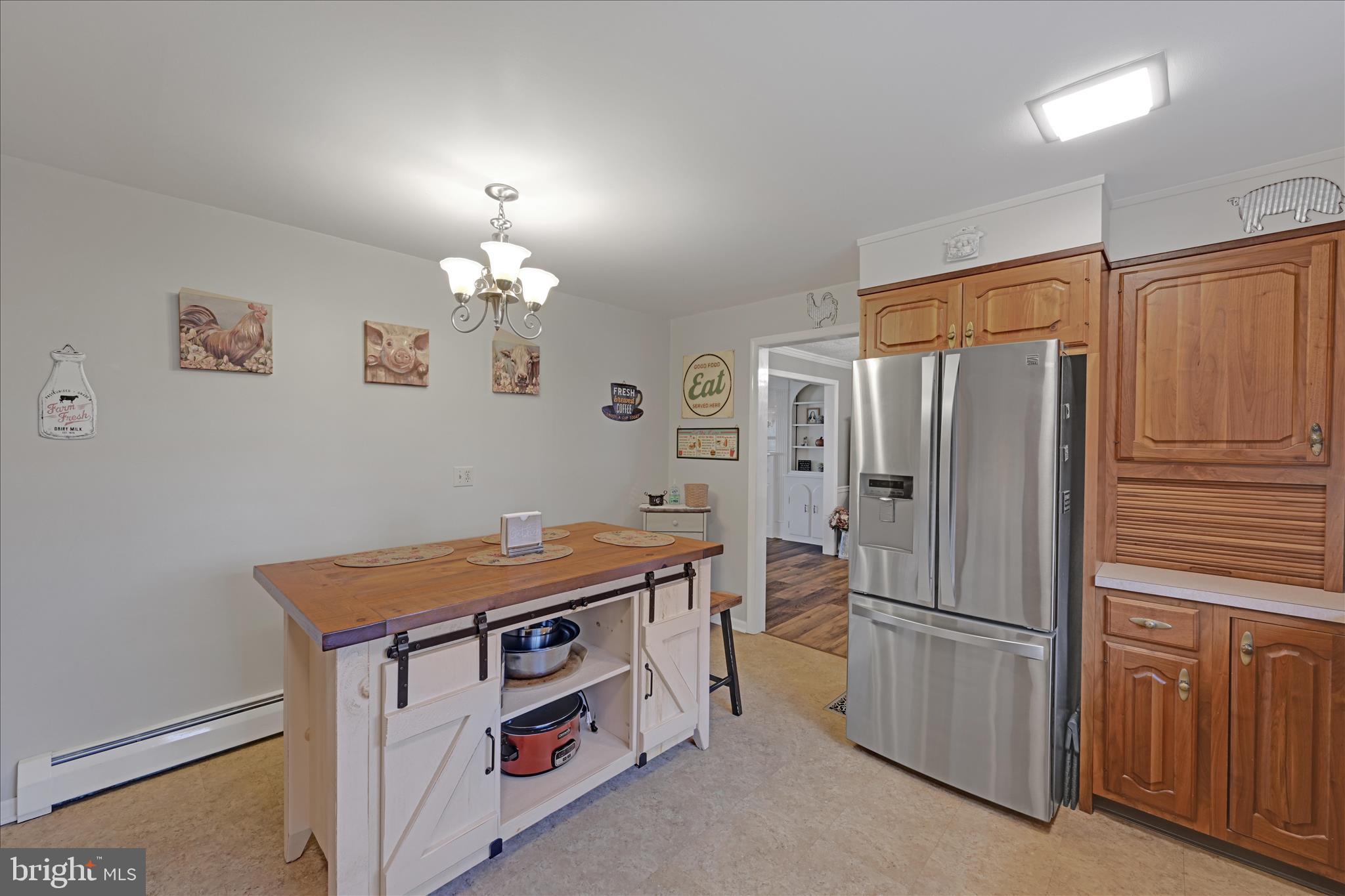 460 Shirksville Road Jonestown, PA 17038 - Photo 13 of 42 a kitchen with stainless steel appliances a refrigerator and a chandelier