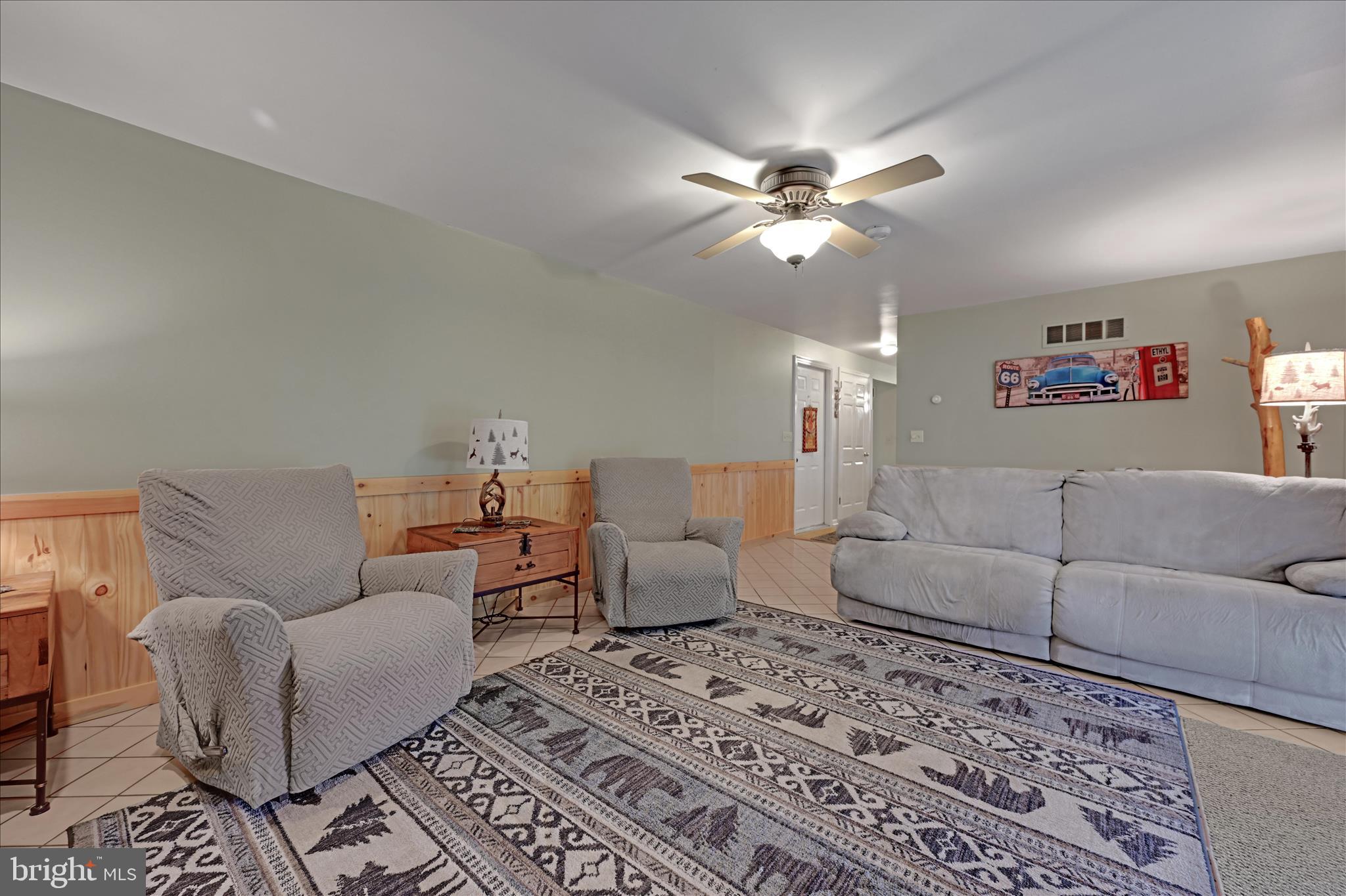 460 Shirksville Road Jonestown, PA 17038 - Photo 17 of 42 a living room with furniture and a chandelier