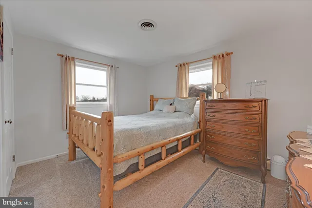 a bed room with a bed and a window