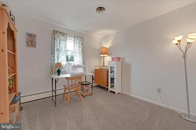 a workspace with furniture and a window