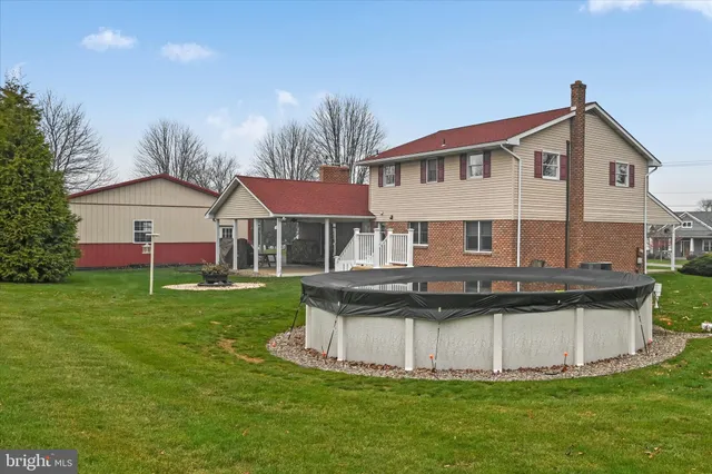 a view of a house with a yard porch and sitting area