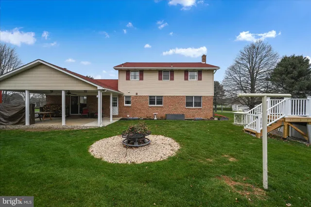 a view of a house with a yard porch and sitting area