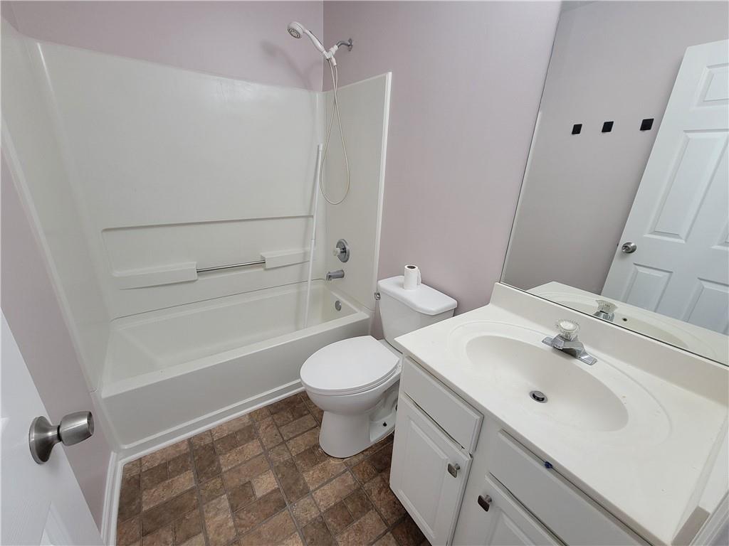 2213 Carlton Chase Road Dacula, GA 30019 - Photo 20 of 30 a bathroom with a sink toilet and shower