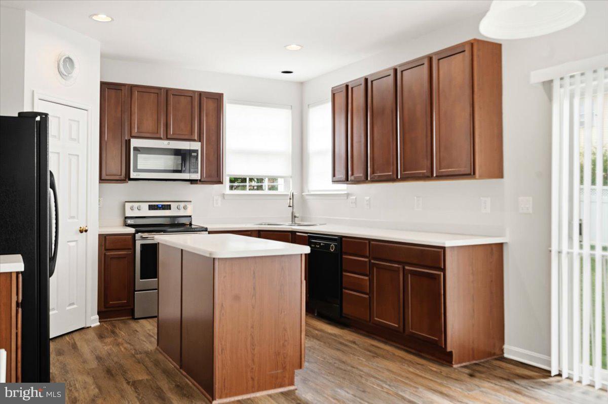 27 Sparkling Brook Road Ranson, WV 25438 - Photo 17 of 51 a kitchen with wooden cabinets and stainless steel appliances