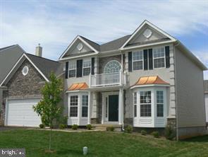 27 Sparkling Brook Road Ranson, WV 25438 - Photo 2 of 51 a front view of a house with a yard