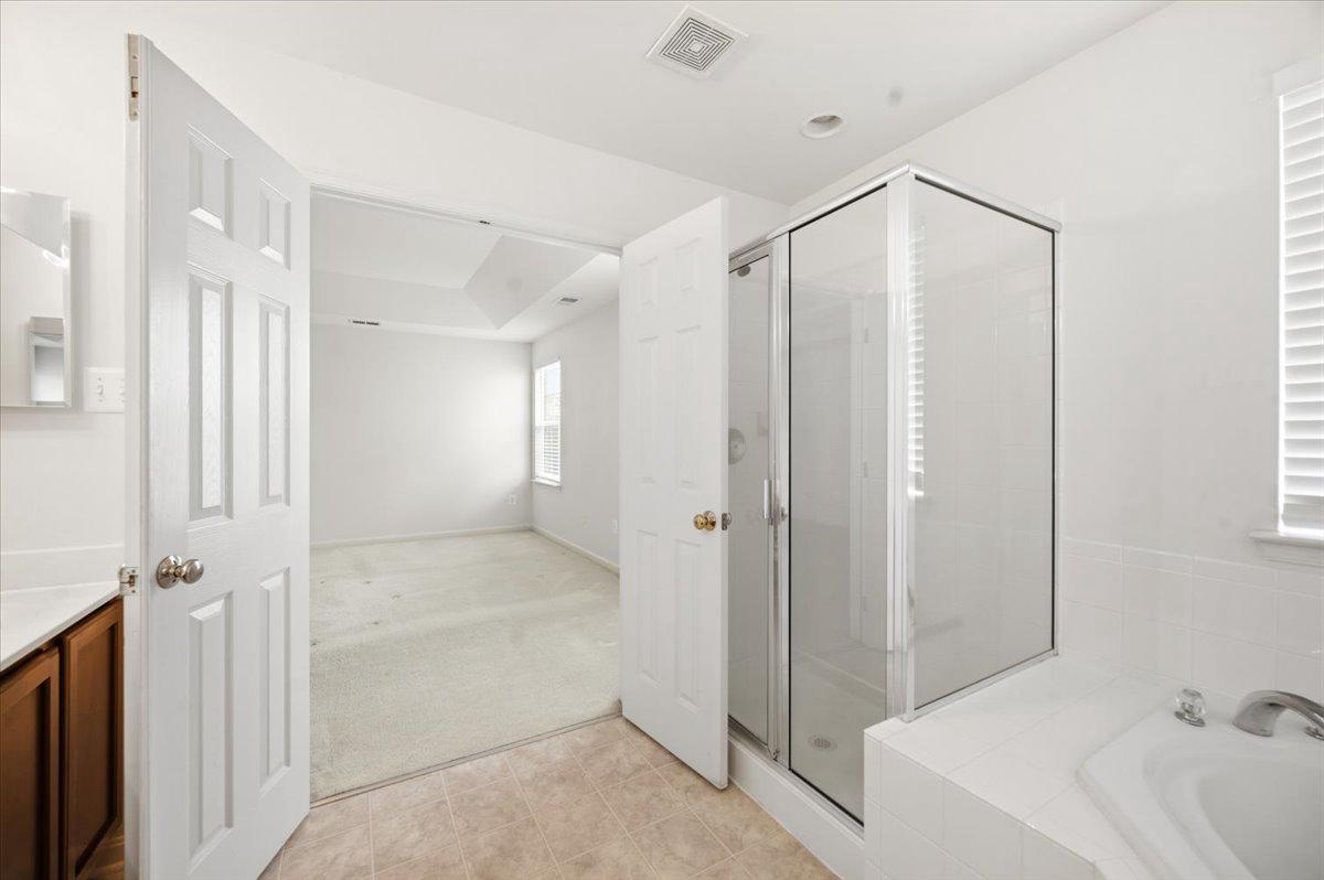27 Sparkling Brook Road Ranson, WV 25438 - Photo 21 of 51 a bathroom with a shower and a tub