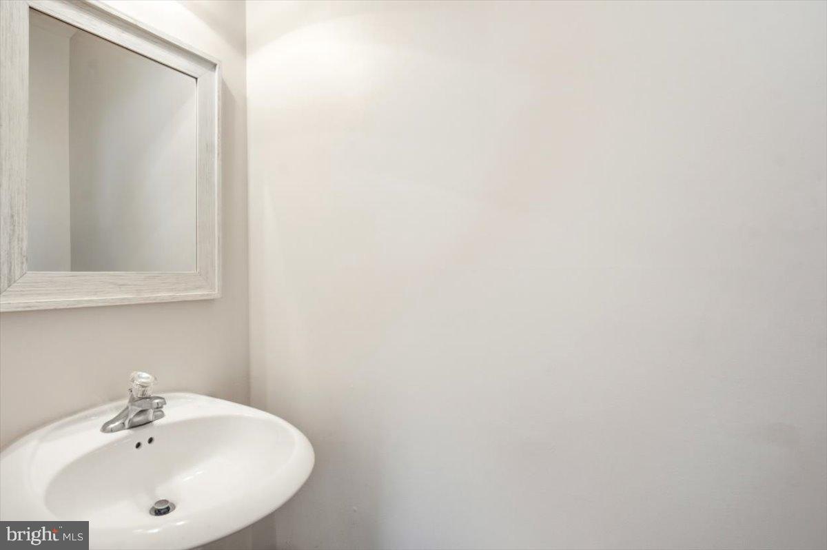 27 Sparkling Brook Road Ranson, WV 25438 - Photo 33 of 51 a bathroom with a sink and a mirror