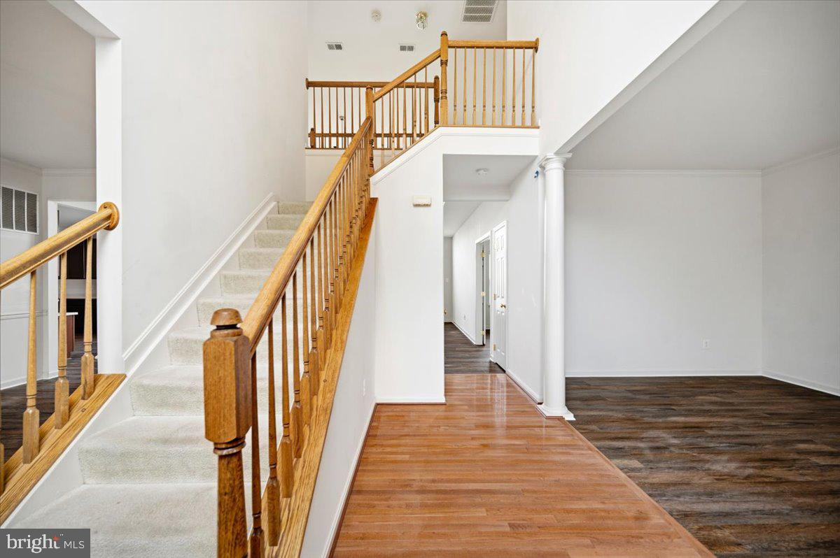 27 Sparkling Brook Road Ranson, WV 25438 - Photo 6 of 51 a view of staircase with lots of frames on wall and wooden floor