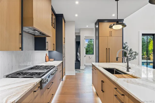 a kitchen with a stove and a sink