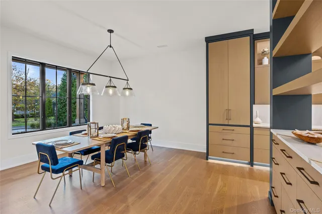 a view of a dining room with furniture window and outside view