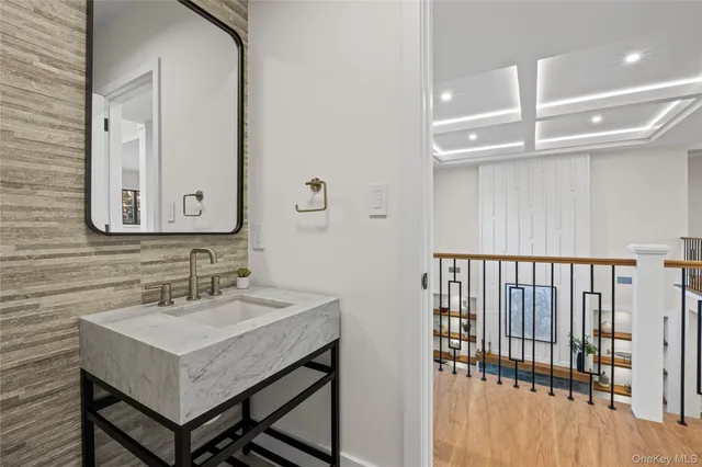 a bathroom with a sink and a mirror