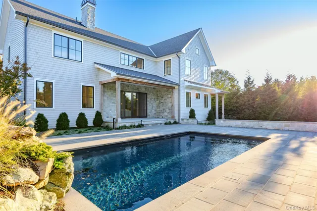 a front view of house with yard outdoor seating and barbeque oven