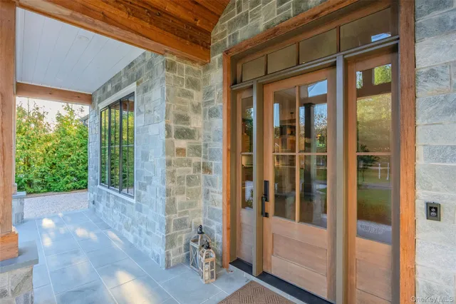 a view of a brick house with a large window