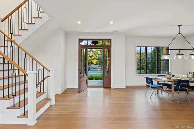 a view of dining room with furniture window and wooden floor