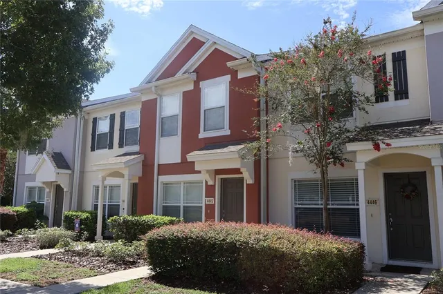 a view of a brick house with a yard