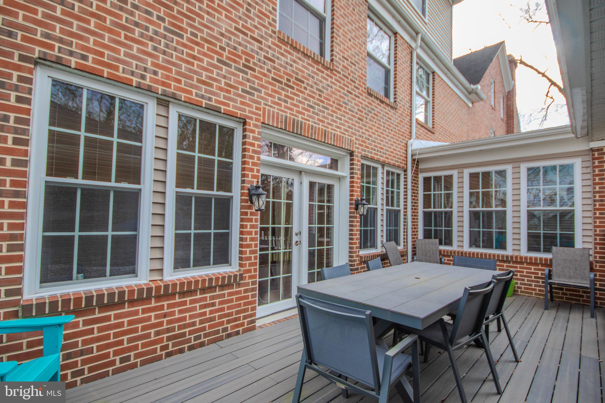 31008 Old Ocean City Road Salisbury, MD 21804 - Photo 57 of 65 a view of a deck with a table and chairs
