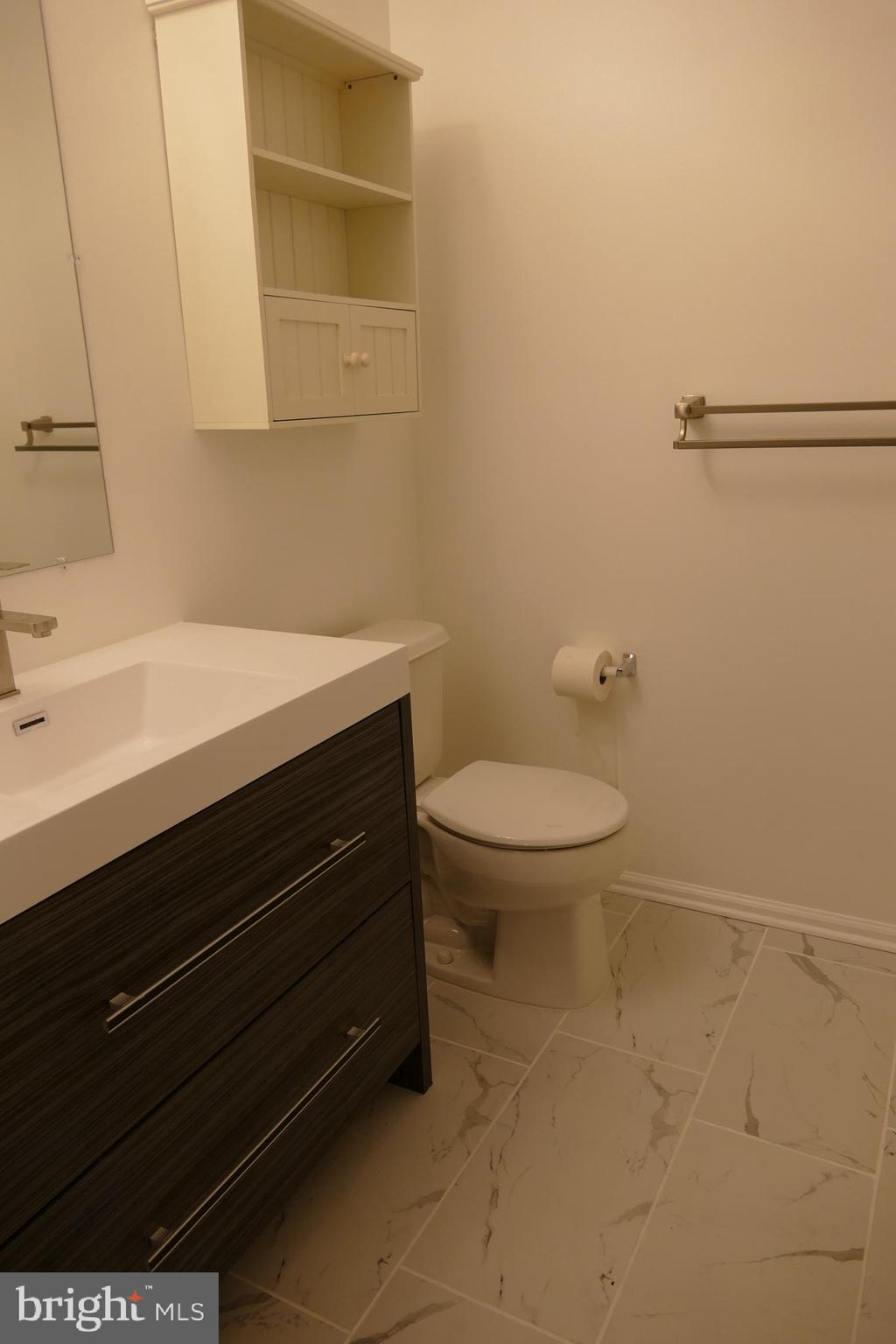 2805 Saxony Drive Mount Laurel, NJ 08054 - Photo 12 of 13 a bathroom with a sink a toilet and a mirror