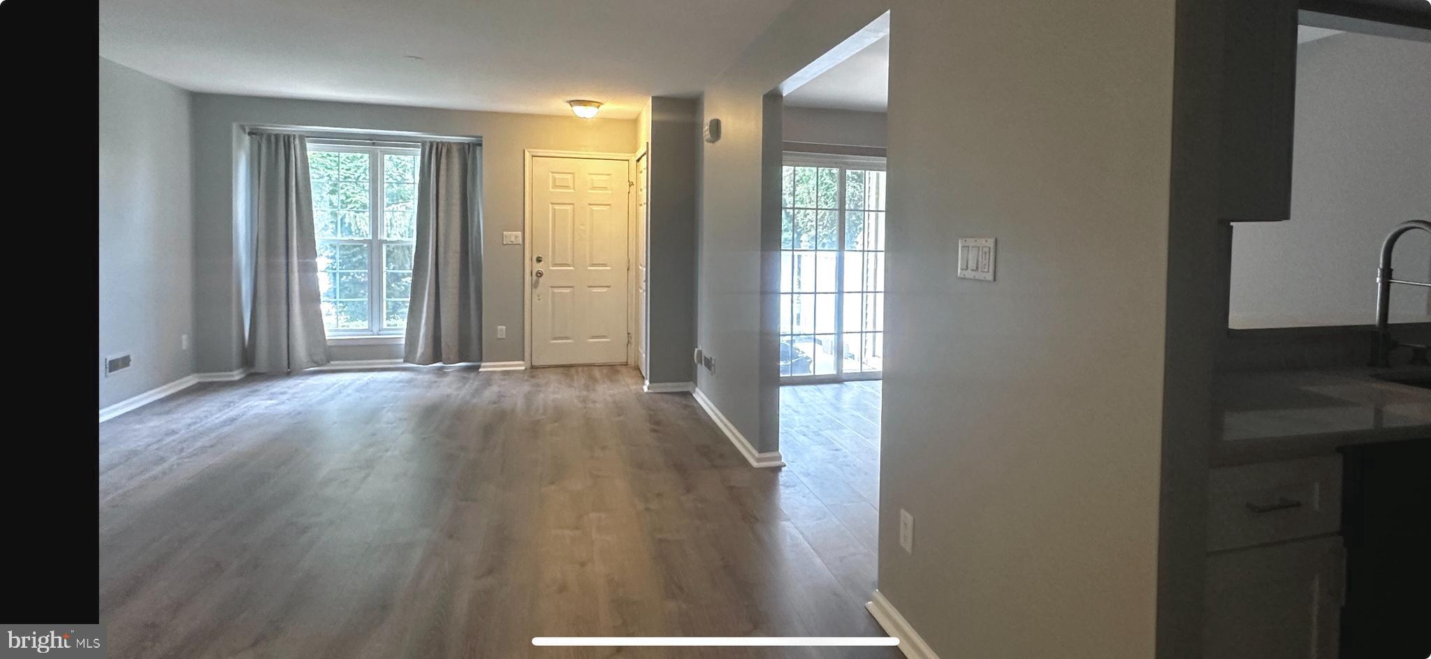 2805 Saxony Drive Mount Laurel, NJ 08054 - Photo 2 of 13 wooden floor in an empty room with a window