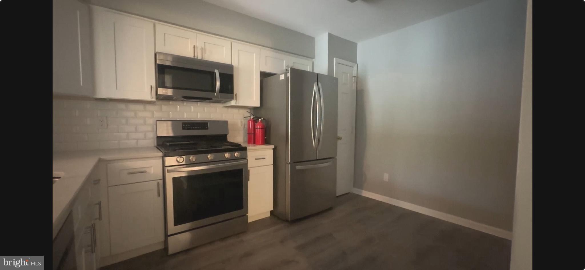 2805 Saxony Drive Mount Laurel, NJ 08054 - Photo 4 of 13 a kitchen with stainless steel appliances a refrigerator stove and microwave
