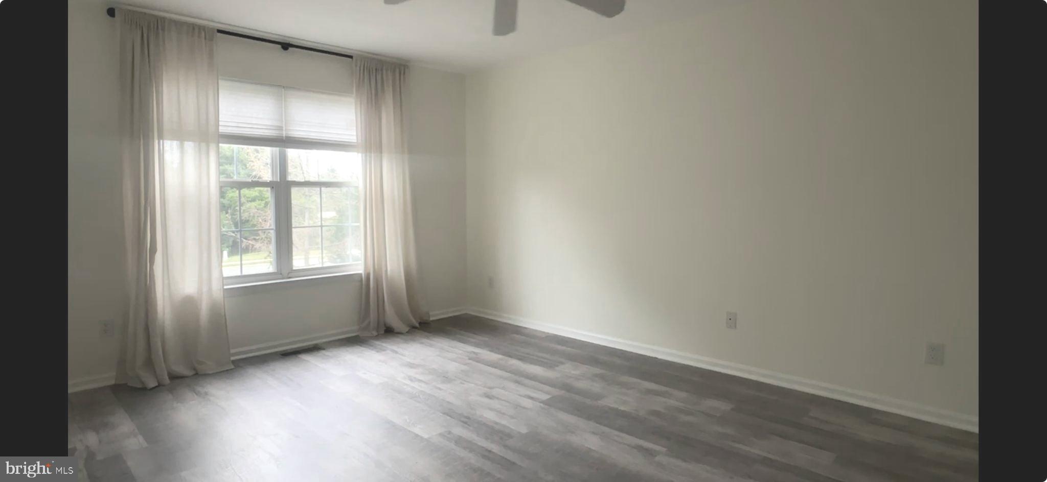 2805 Saxony Drive Mount Laurel, NJ 08054 - Photo 8 of 13 an empty room with wooden floor and windows