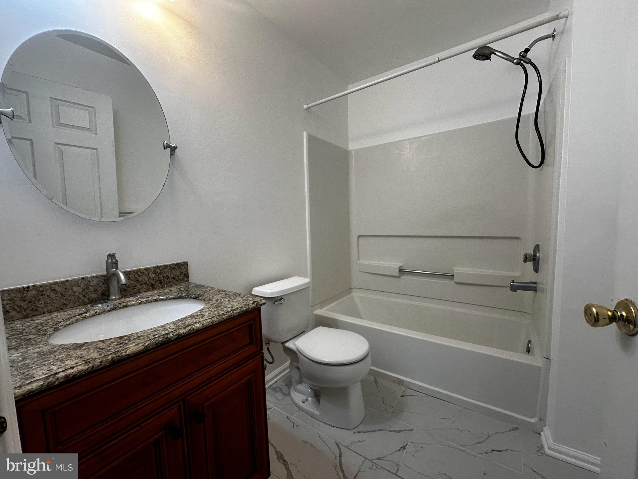 2805 Saxony Drive Mount Laurel, NJ 08054 - Photo 9 of 13 a bathroom with a granite countertop sink toilet and shower