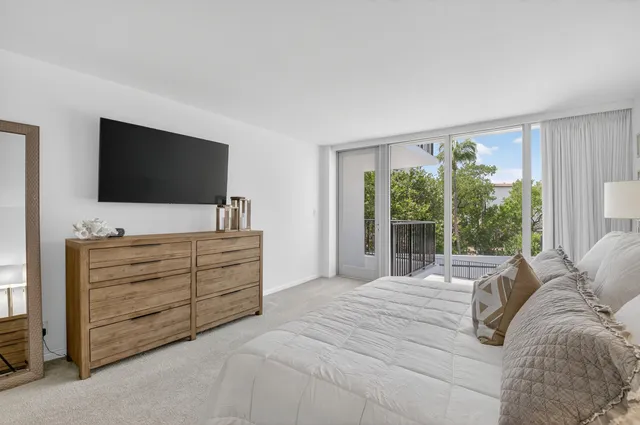 a bathroom with a double vanity sink mirror and shower