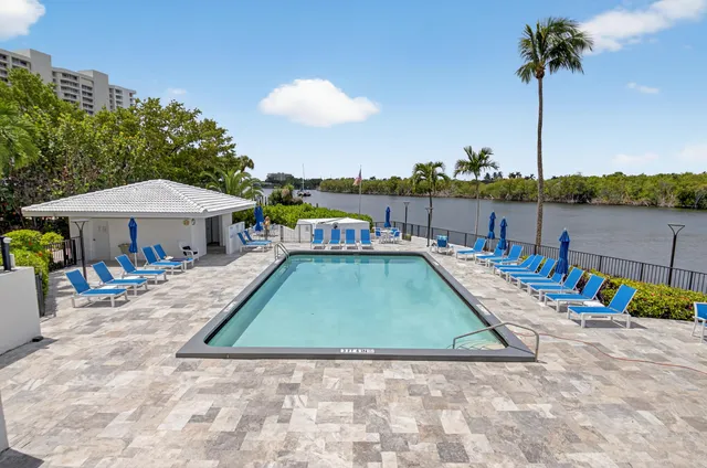 a view of swimming pool with outdoor seating