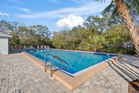 a view of a swimming pool with a lounge chairs