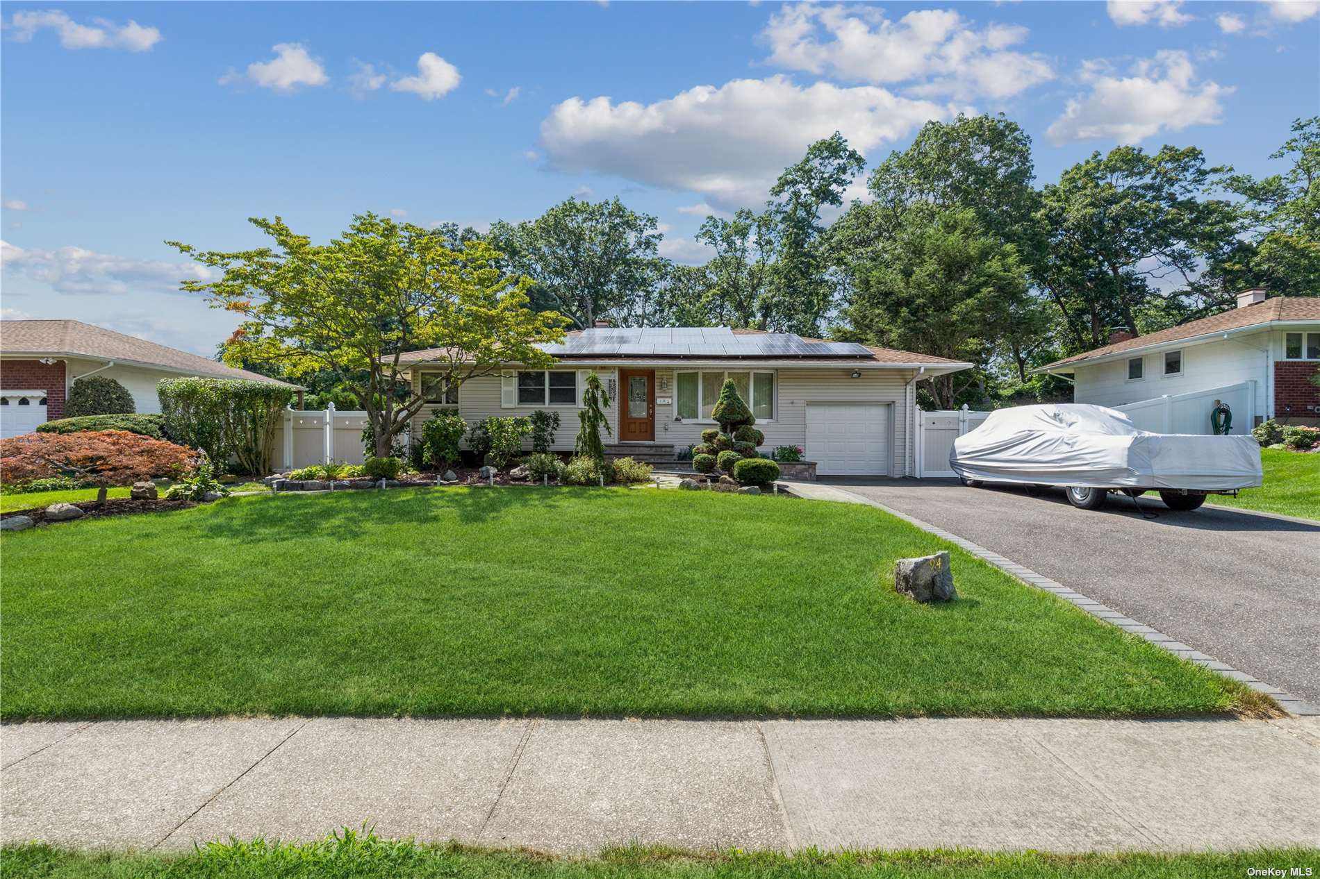 a front view of a house with garden