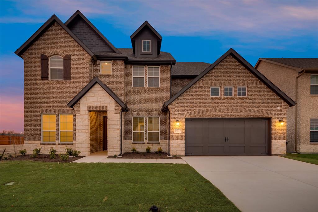 15112 Devonne Drive Aledo, TX 76008 - Photo 1 of 1 a front view of a house with a yard and garage