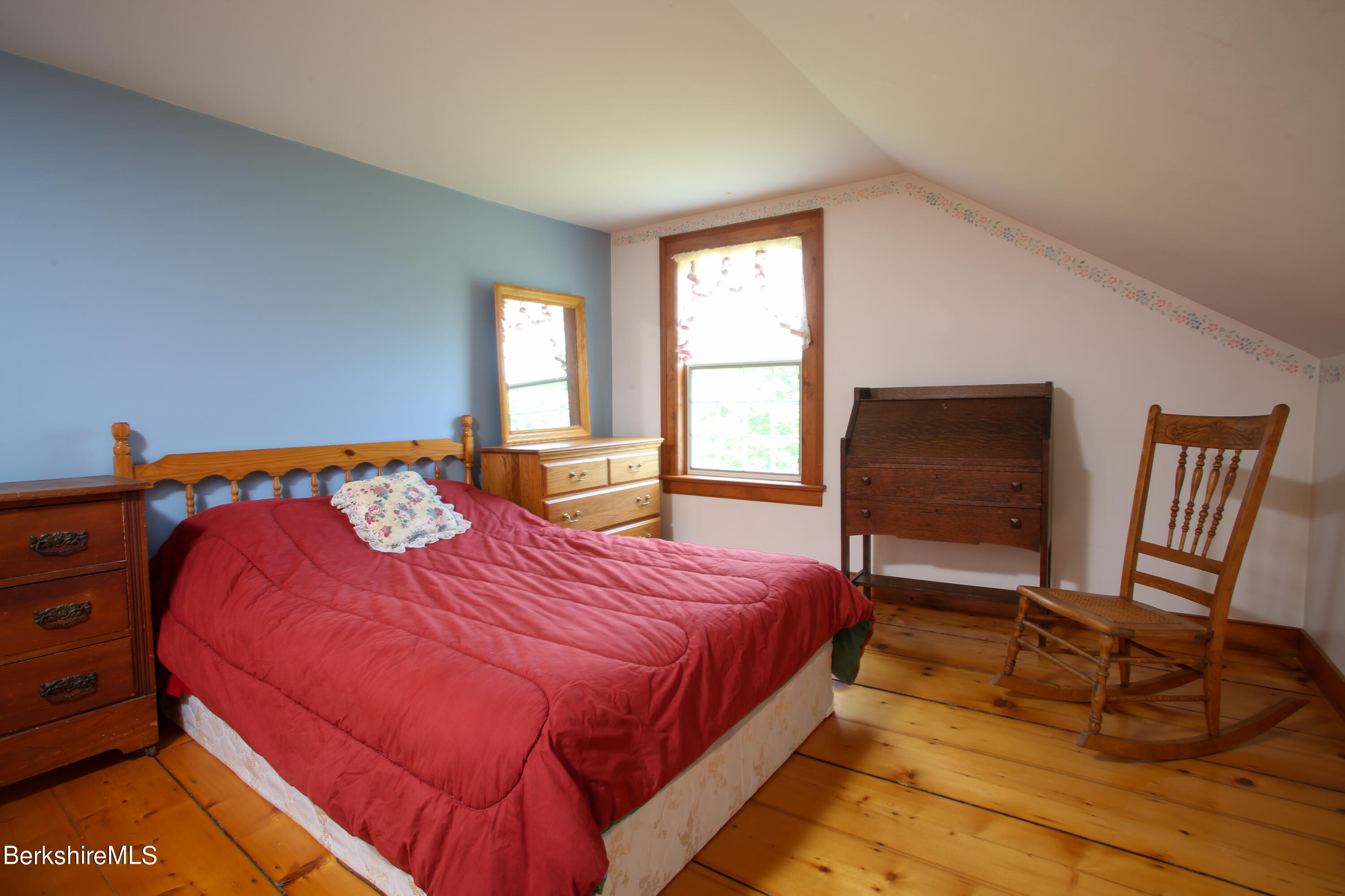 61 Sumner Stetson Road Heath, MA 01339 - Photo 15 of 34 a bedroom with a bed and a flat screen tv