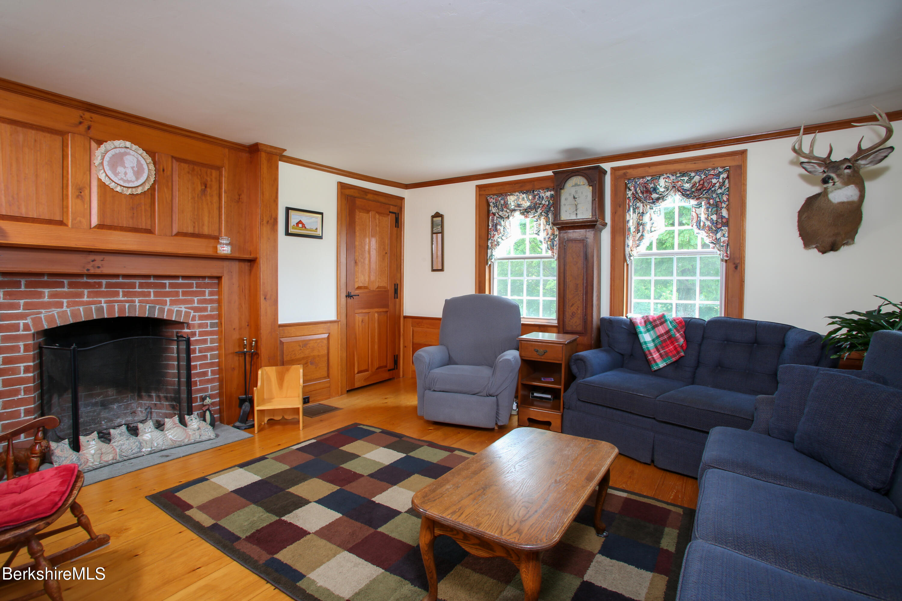 61 Sumner Stetson Road Heath, MA 01339 - Photo 9 of 34 a living room with furniture and a fireplace