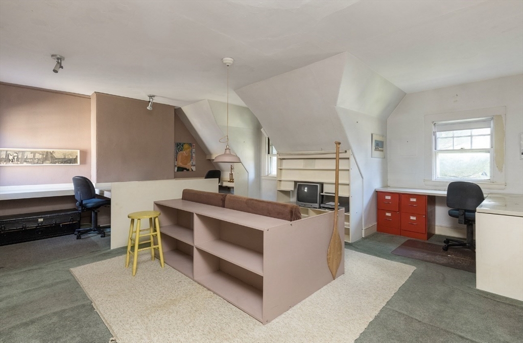 63 Griggs Road Brookline, MA 02446 - Photo 11 of 12 a bed room with furniture and a window