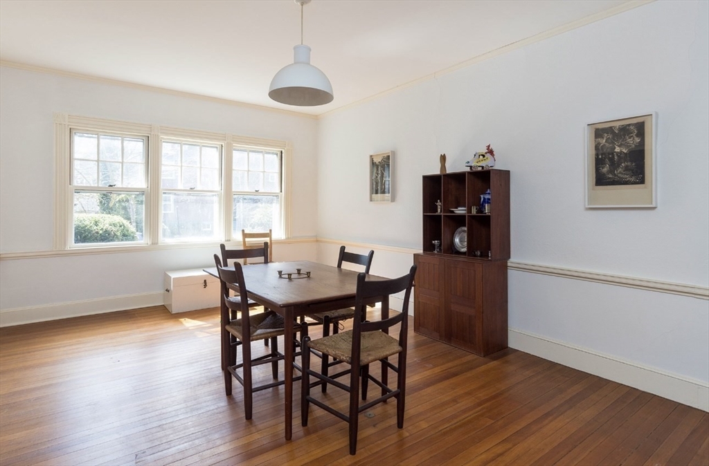 63 Griggs Road Brookline, MA 02446 - Photo 4 of 12 a view of a dining room with furniture and wooden floor
