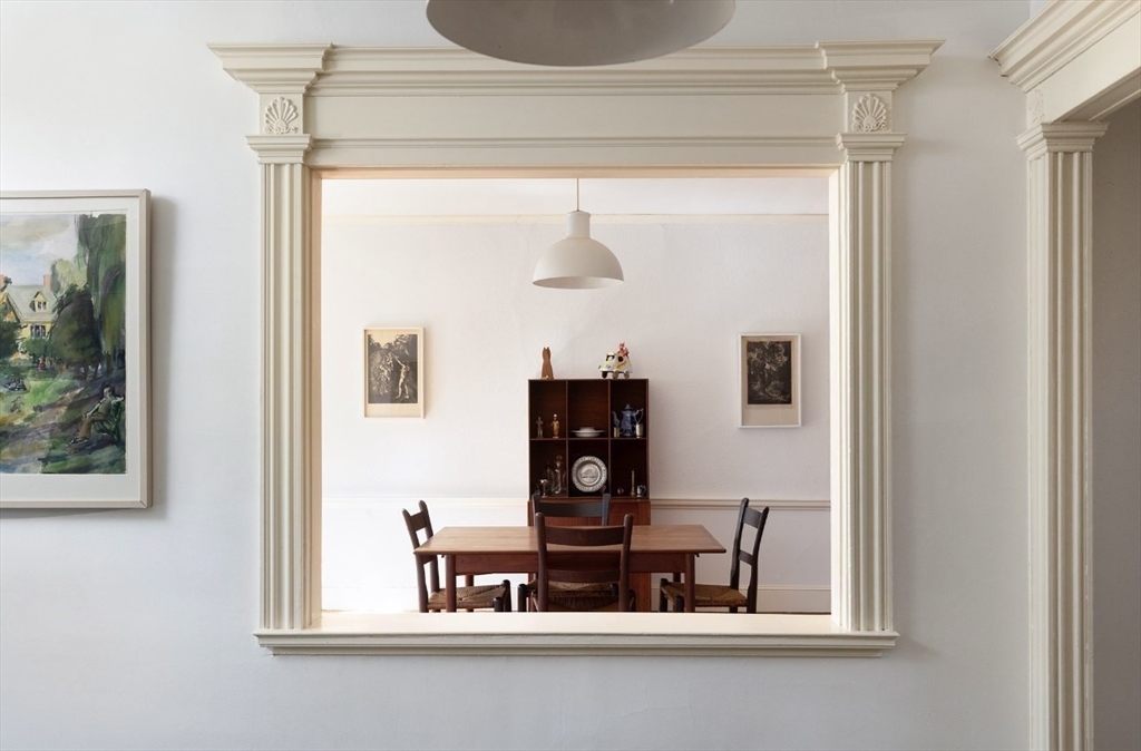 63 Griggs Road Brookline, MA 02446 - Photo 5 of 12 a living room with furniture and a window