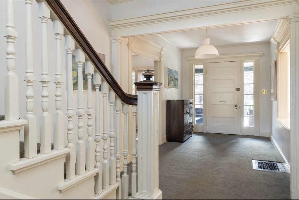 63 Griggs Road Brookline, MA 02446 - Photo 7 of 12 a view of entryway with furniture and wooden floor