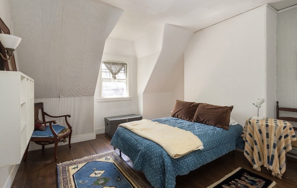 63 Griggs Road Brookline, MA 02446 - Photo 10 of 12 a bedroom with a bed and a window