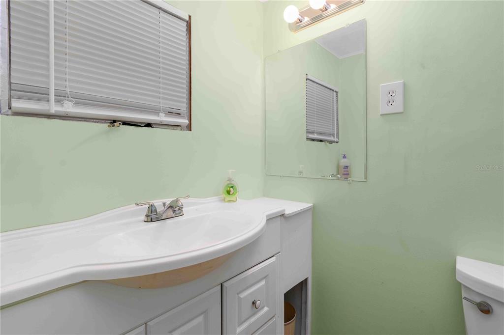 10399 67th Avenue North, Unit 4 St. Petersburg, FL 33708 - Photo 19 of 35 a bathroom with a sink and a toilet