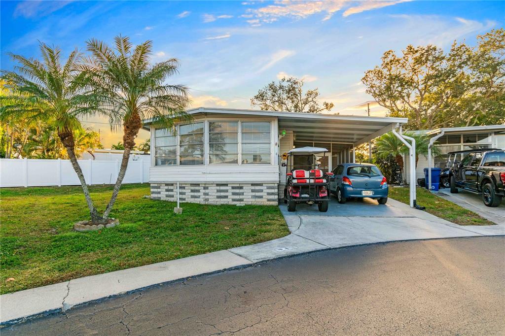 10399 67th Avenue North, Unit 4 St. Petersburg, FL 33708 - Photo 2 of 35 a view of house with outdoor space and entertaining space