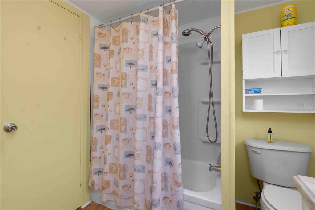 10399 67th Avenue North, Unit 4 St. Petersburg, FL 33708 - Photo 24 of 35 a bathroom with a shower and a toilet