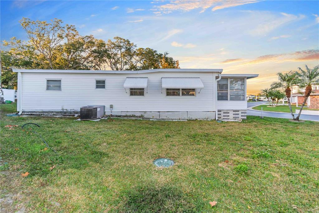 10399 67th Avenue North, Unit 4 St. Petersburg, FL 33708 - Photo 26 of 35 a view of a house with a backyard