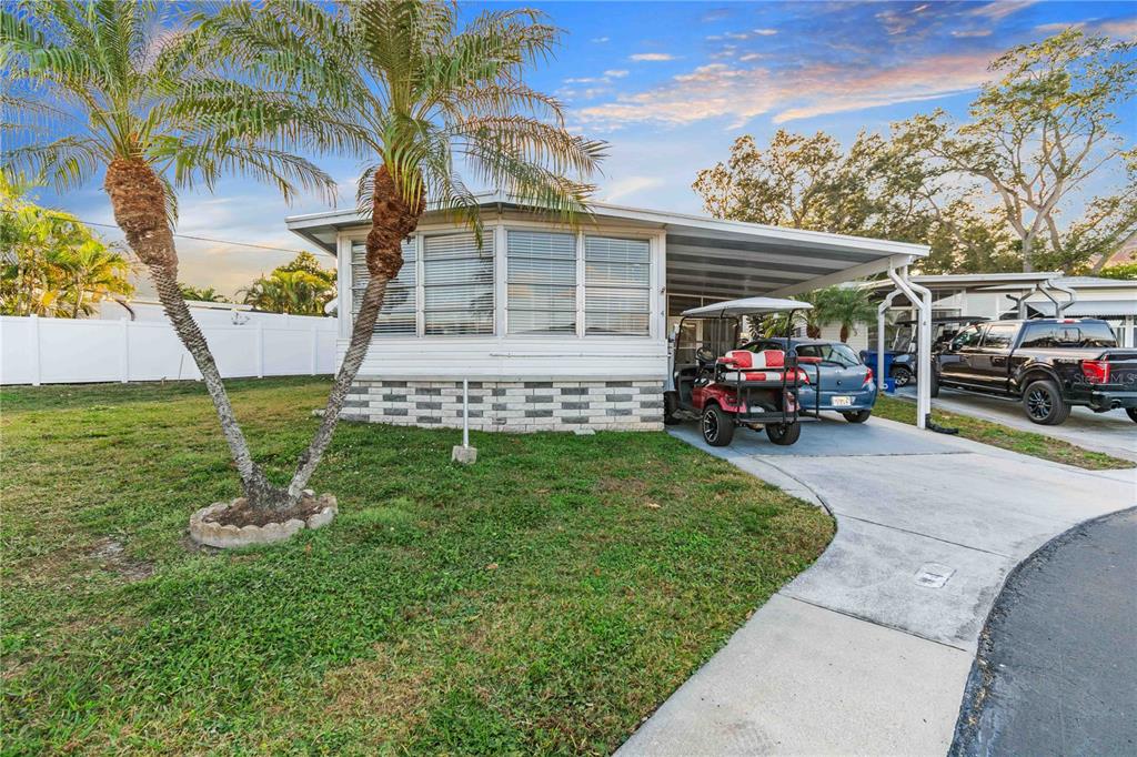 10399 67th Avenue North, Unit 4 St. Petersburg, FL 33708 - Photo 3 of 35 a view of a house with backyard