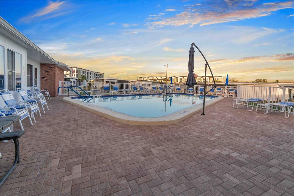 10399 67th Avenue North, Unit 4 St. Petersburg, FL 33708 - Photo 31 of 35 a view of a terrace with chairs